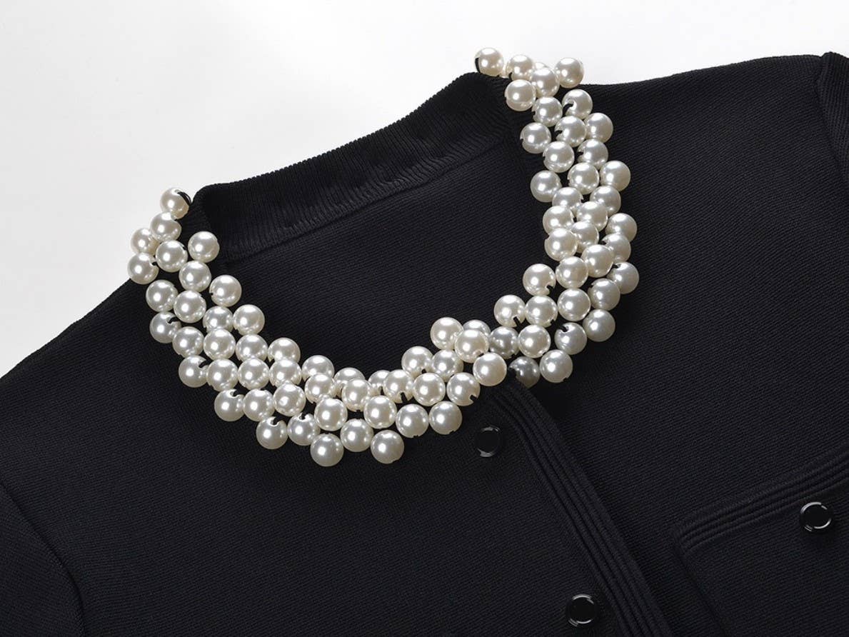 Zwarte gebreide tweed set met parelkraag